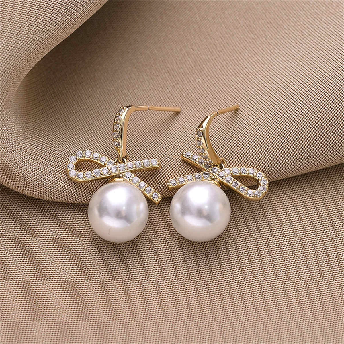 Elite White Cubic Zirconia Pearl Goldtone Bow Drop Earrings Breathable